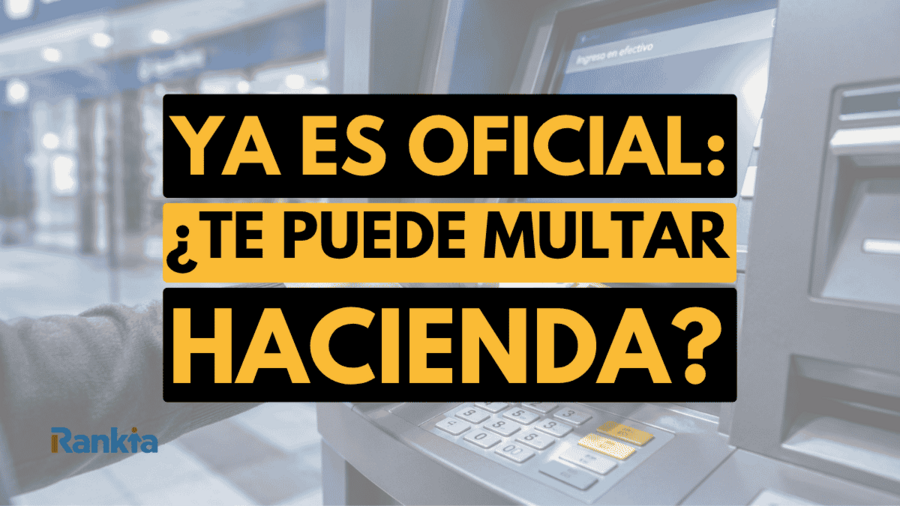 Primer plano de un cajero automático con una mano introduciendo billetes de euro en la ranura de ingreso. Sobre la imagen aparece un mensaje destacado en negro y amarillo con el texto "Ya es oficial: ¿Te puede multar Hacienda?", mientras el fondo de una sucursal bancaria aparece desenfocado. También se observa el logotipo de Rankia en la esquina inferior izquierda.
