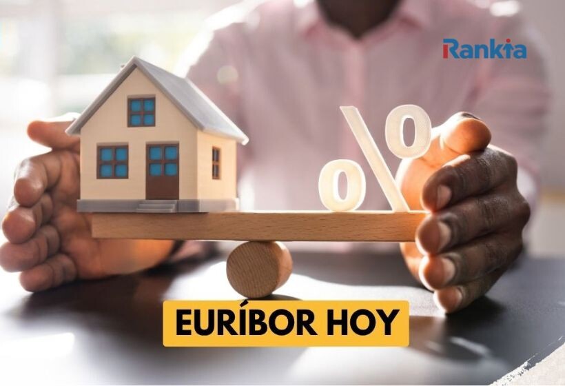 Casa en miniatura sobre una balanza, símbolos de porcentaje y una persona sosteniendo el otro extremo, con el rótulo «EURIBOR HOY».