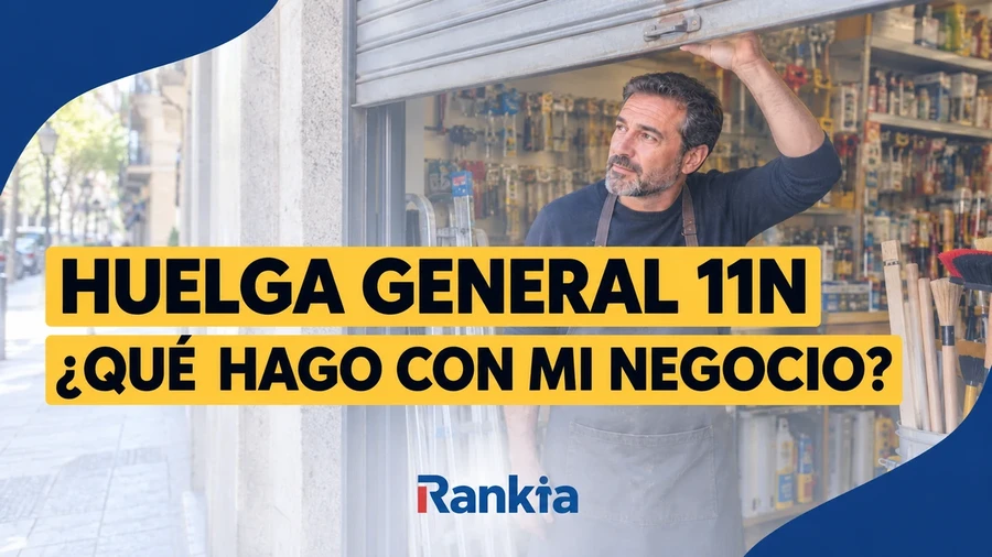 Autónomo con la persiana de su comercio a medio bajar ante la huelga general del 11 de noviembre.