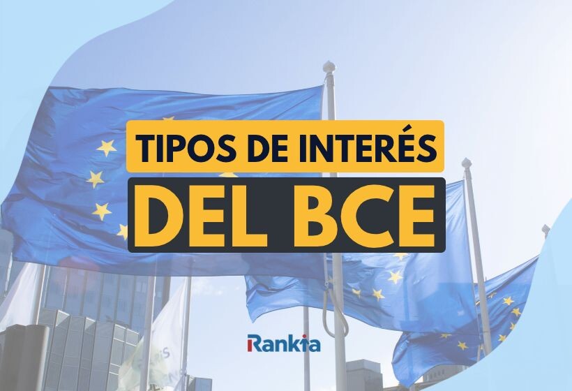 Banderas de la Unión Europea ondeando frente a un edificio de oficinas, con el texto “Tipos de interés del BCE” en letras grandes sobre fondo amarillo y negro, y el logo de Rankia en la parte inferior.